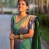 Mint Green Saree with Midnight Blue and Peacock Golden Border